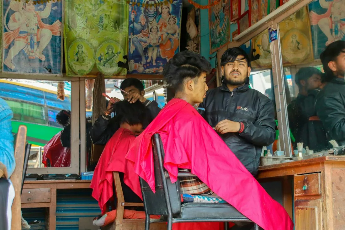 A barber cutting a client's hair